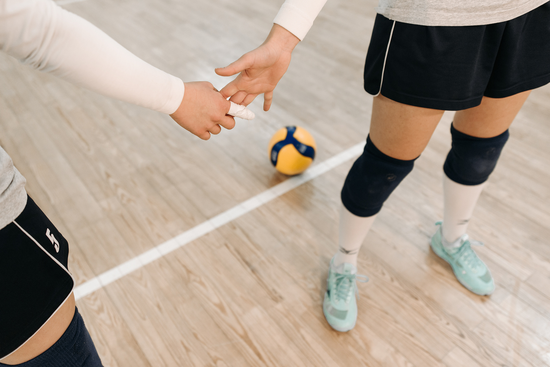 Volleyball Players Holding Hands